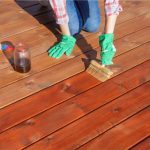 Deck staining by worker