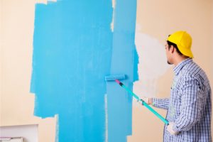 Worker Painting the Wall at Home